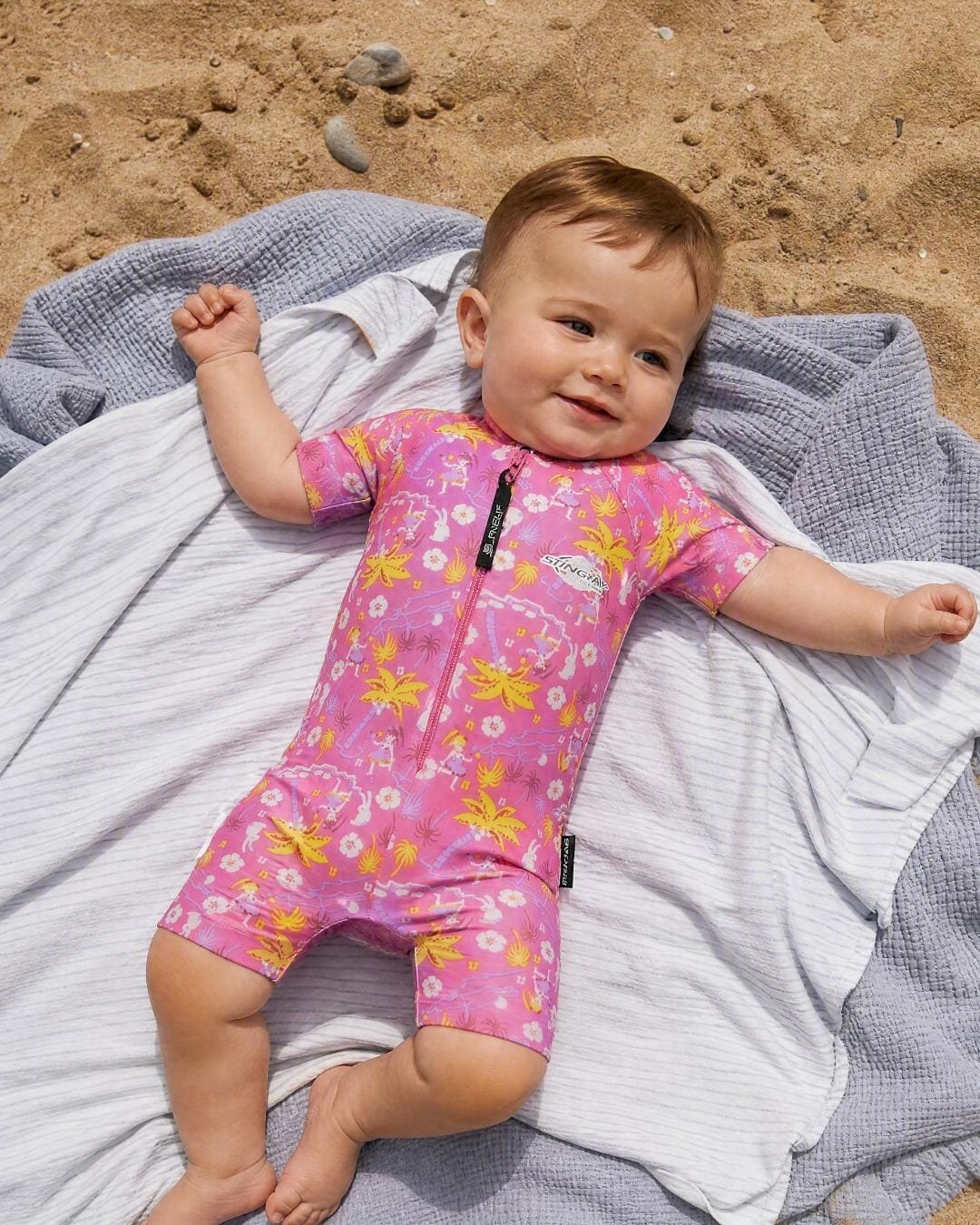 Baby wearing short sleeve UV swimsuit romper UPF 50+ - hawaii on the beach