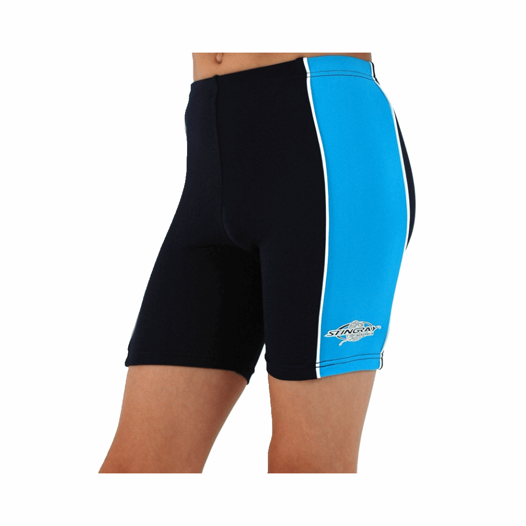 Boy/girl wearing the navy and azure Stingray Kids' Unisex Swim Shorts UPF 50+. These swimming trunks feature a contrasting azure side panel and the best UV sun protection for swimming, water activities and outdoor play.