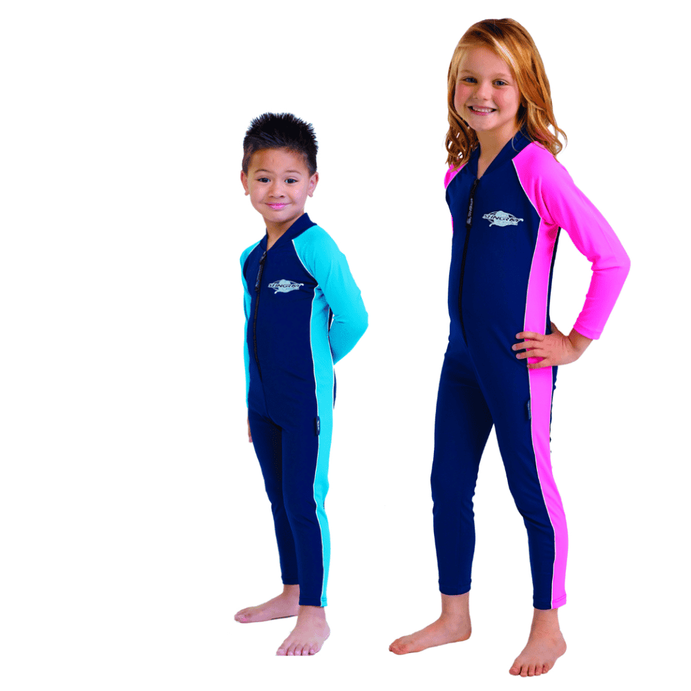 Boy and girl wearing the full-body Stingray sun protection suit with UPF 50+ fabric