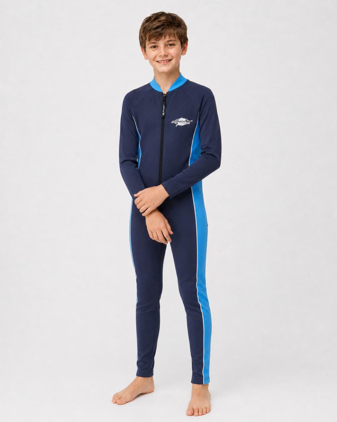 14 year old boy wearing a navy and azure full-body UV swimsuit on a white background