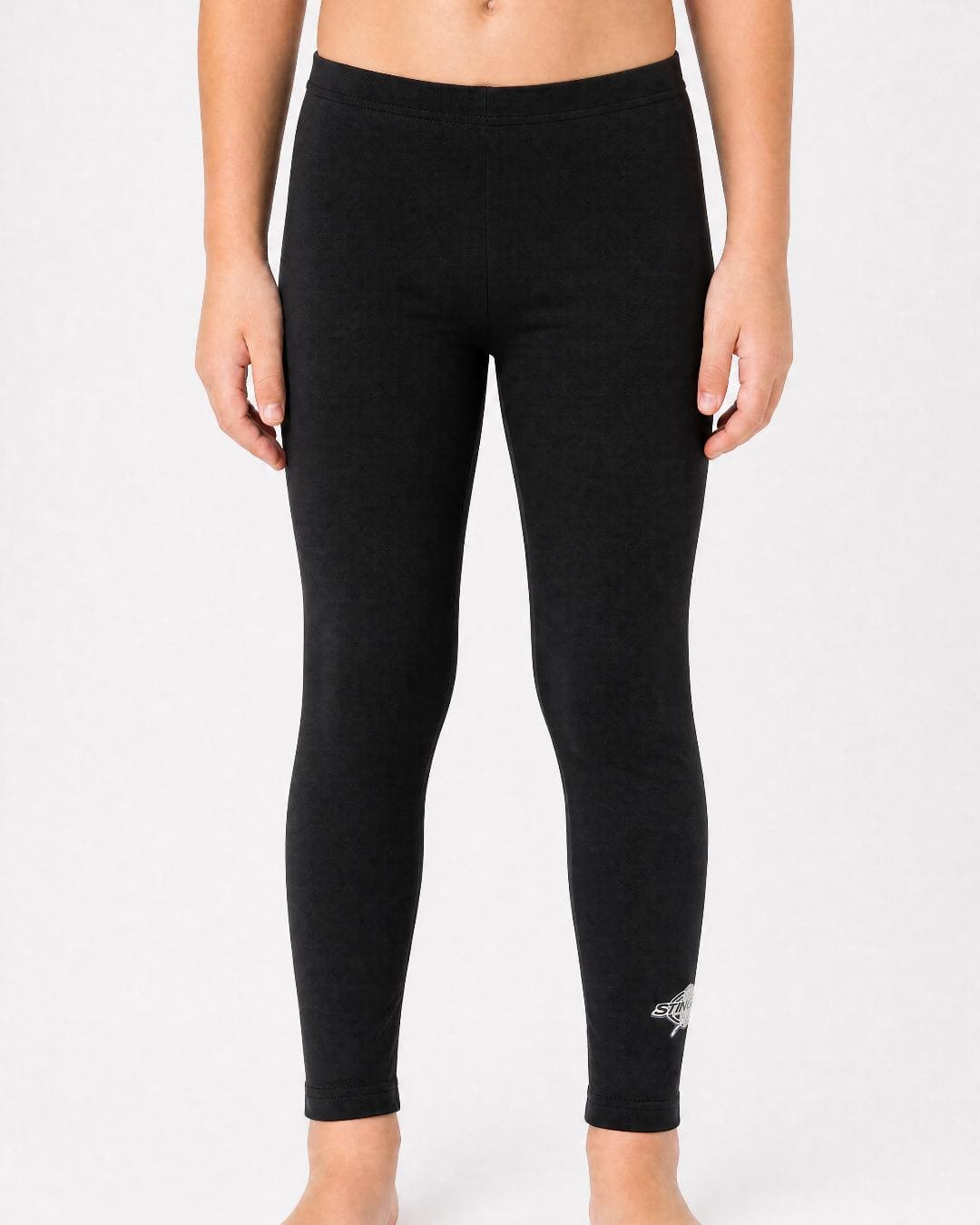 14 year old wearing black UV swim leggings UPF 50+ on a white background