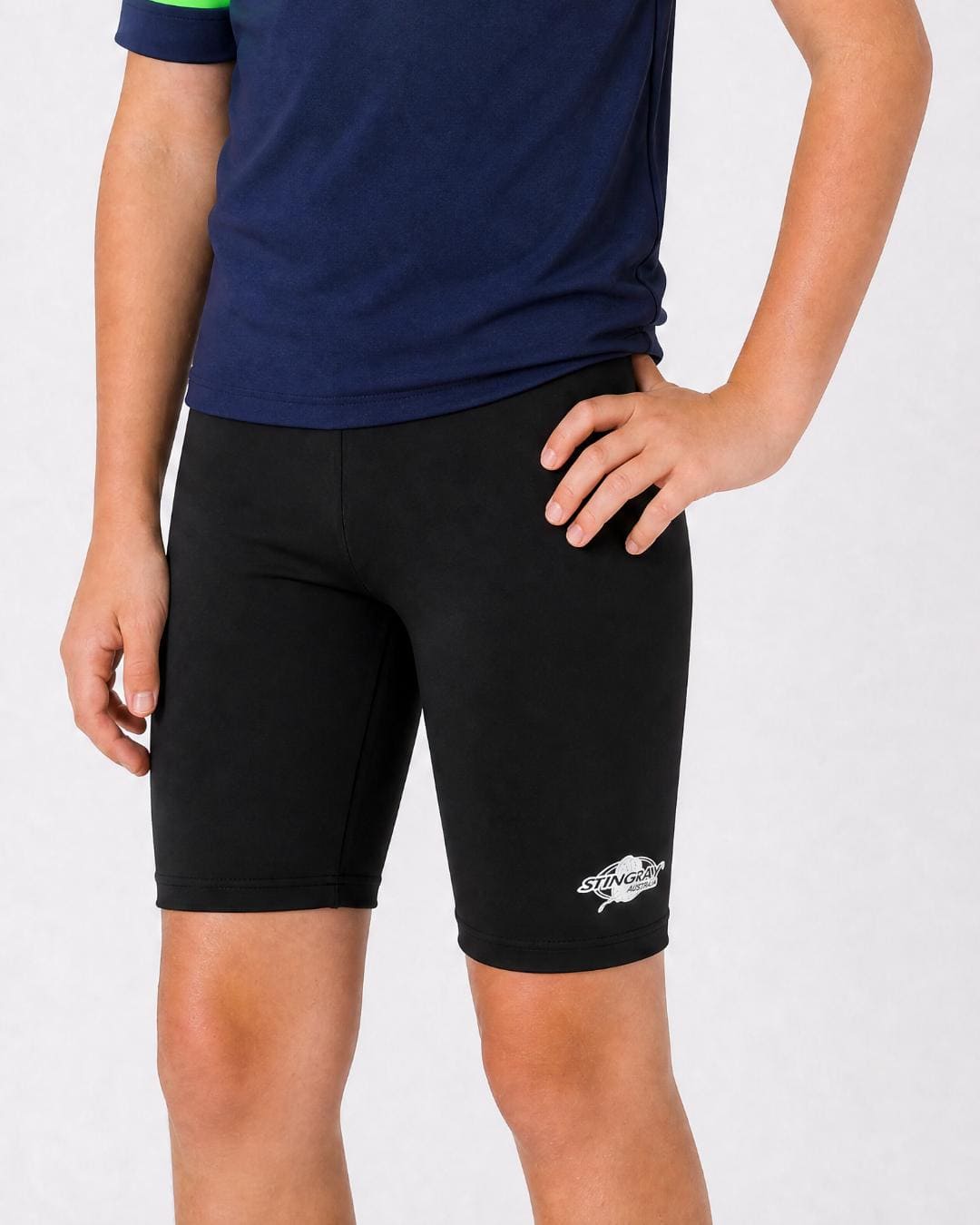 14 year old wearing black UV swimming shorts/trunks UPF 50+ in a white studio
