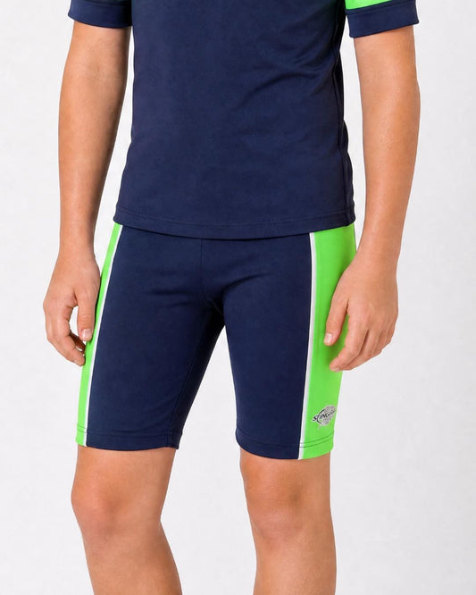 14 year old wearing navy and green UV swimming shorts/trunks UPF 50+ in a white studio