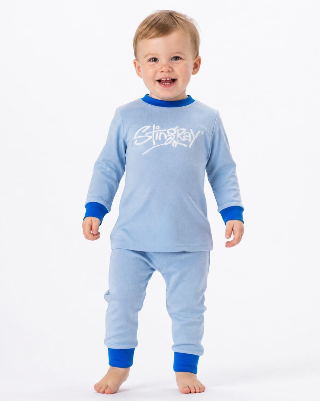 16 month old baby wearing the Stingray 2-piece UV sunsuit set in blue, in the studio