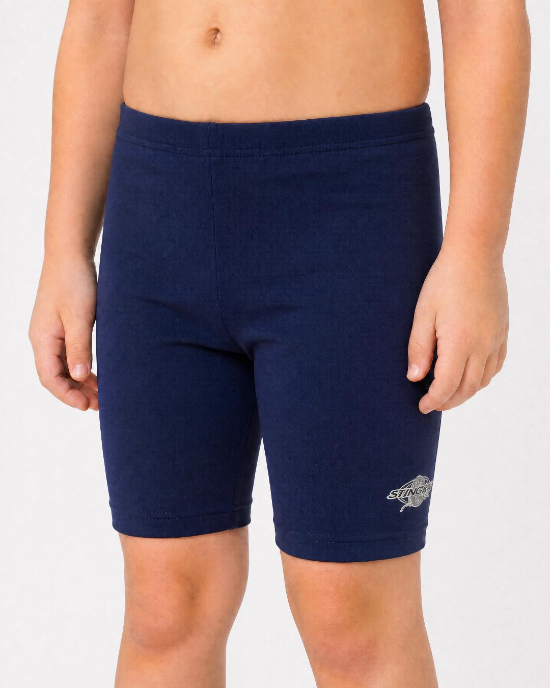 2 year old toddler/child wearing navy UV swimming shorts/trunks UPF 50+ in a white studio