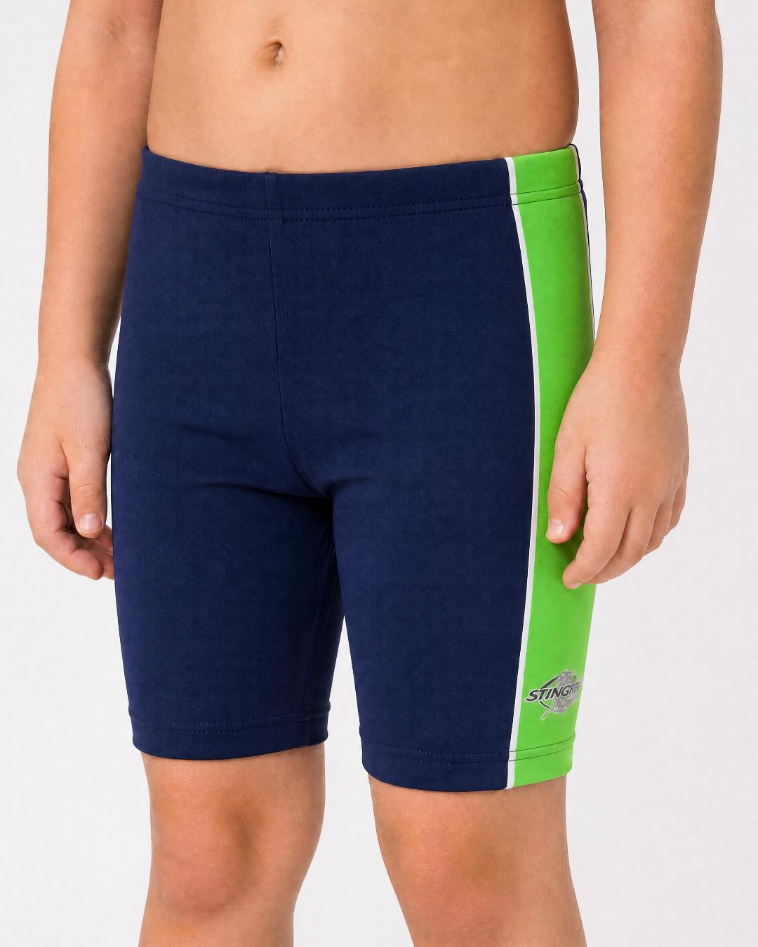 2 year old toddler/child wearing navy and green UV swimming shorts/trunks UPF 50+ in a white studio