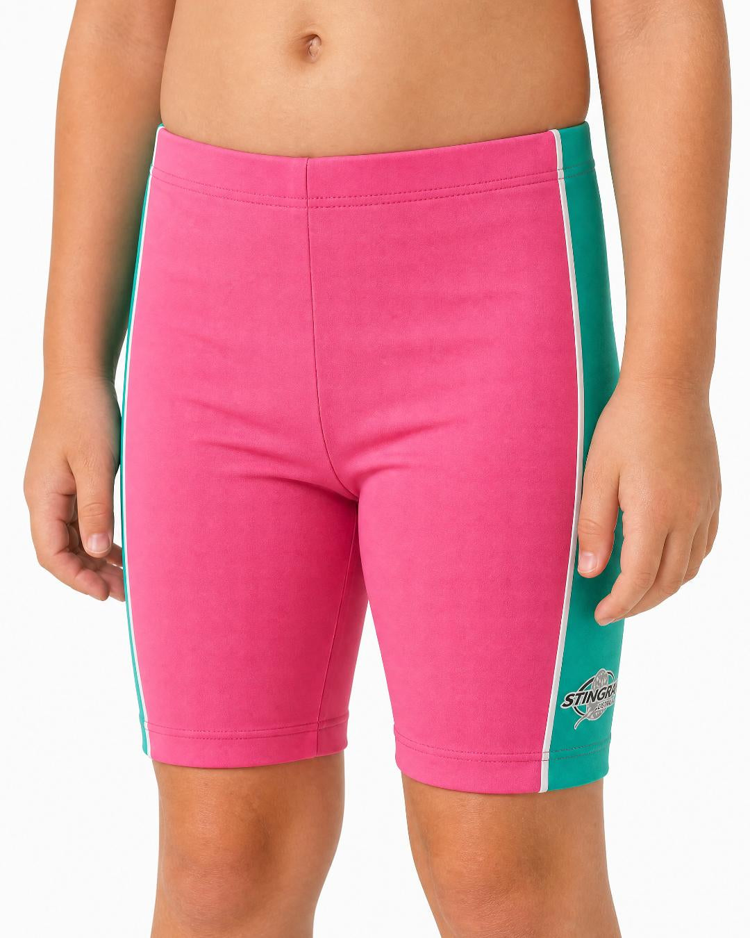 2 year old toddler/child wearing pink and teal UV swimming shorts/trunks UPF 50+ in a white studio