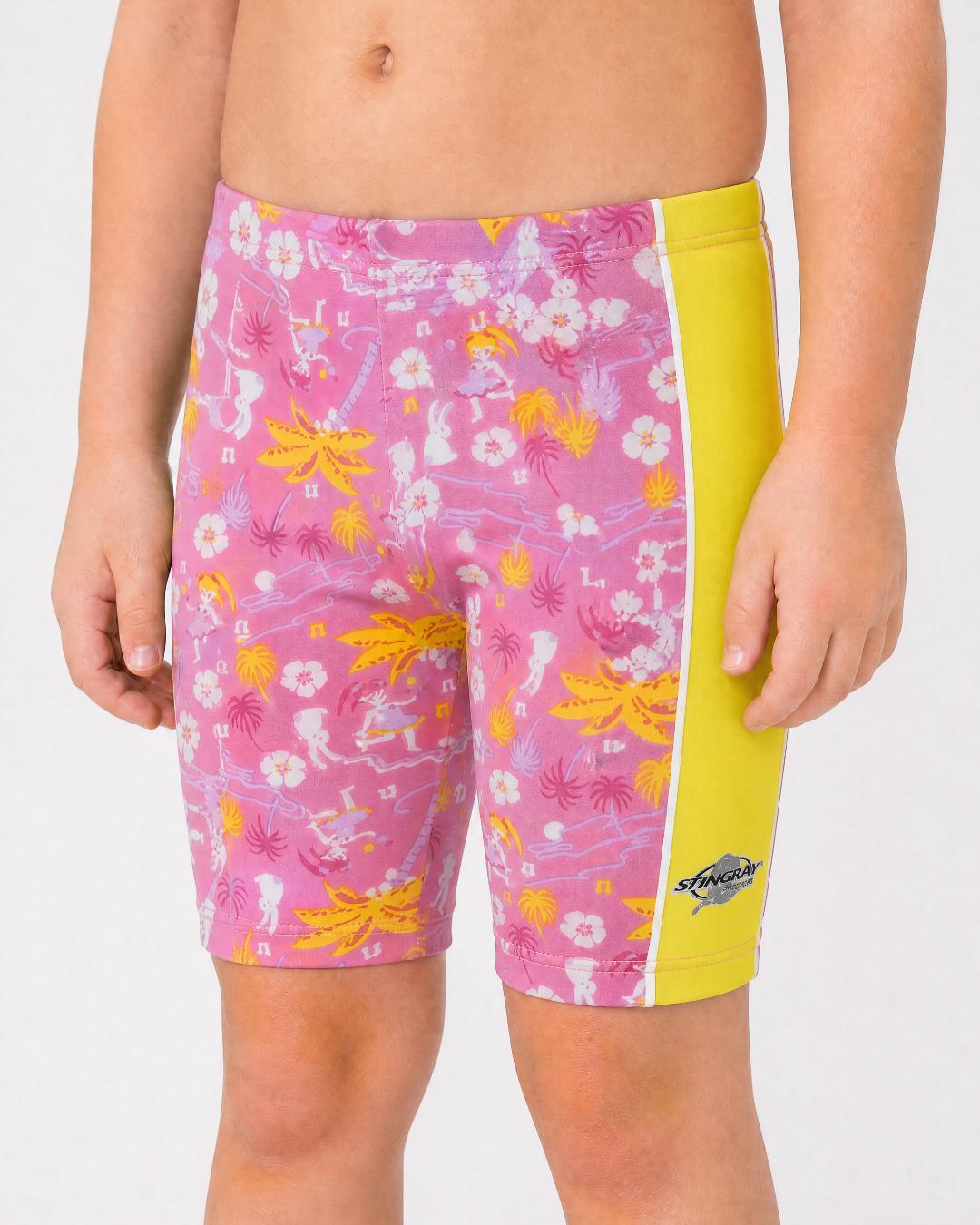 2 year old toddler/child wearing yellow and floral pattern UV swimming shorts/trunks UPF 50+ in a white studio