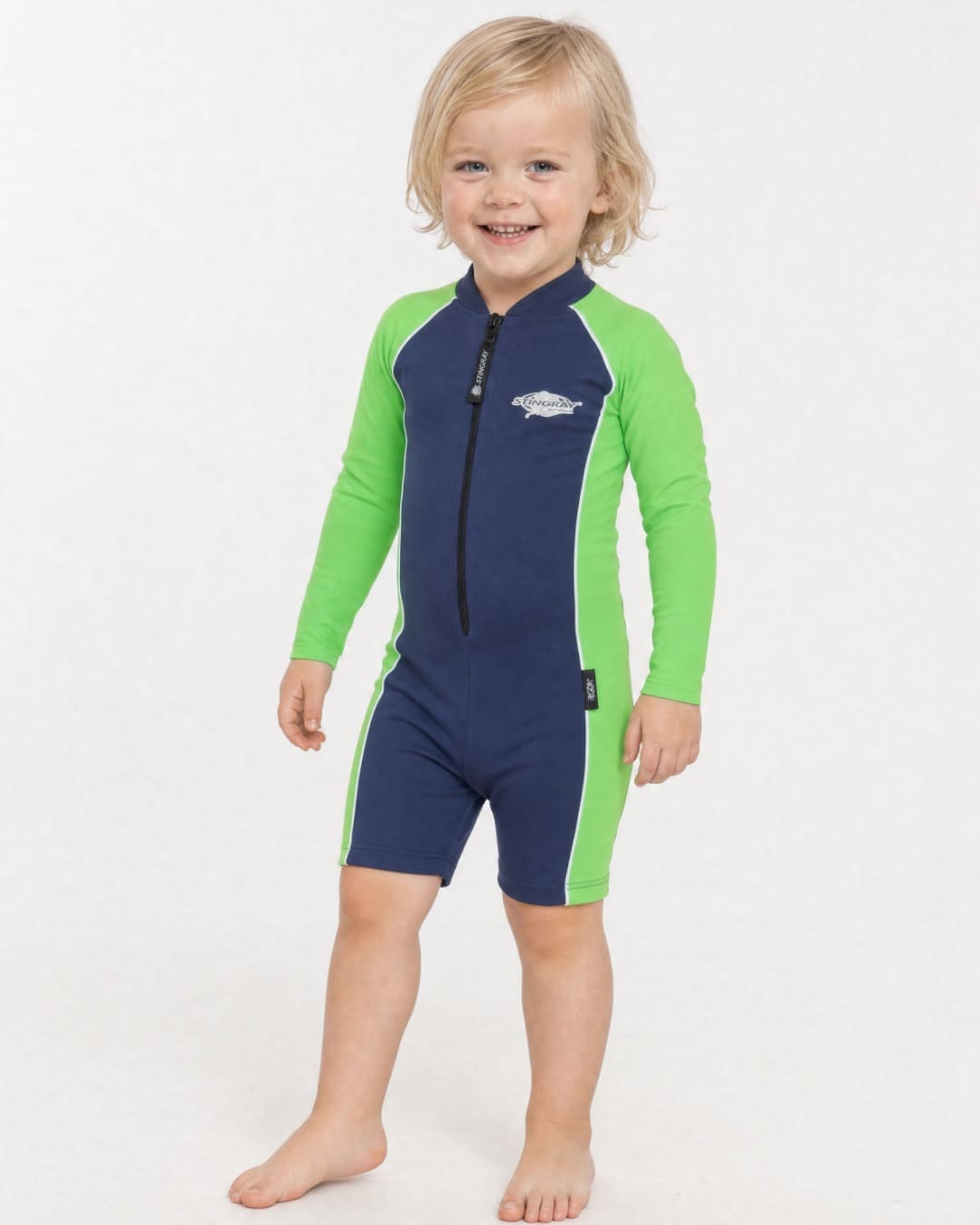 2 year old wearing a long sleeve UV swimsuit UPF 50+ - navy green
