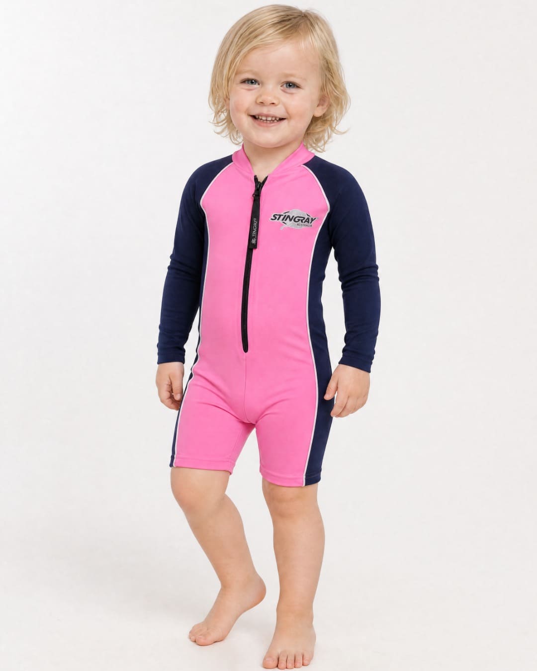 2 year old wearing a long sleeve UV swimsuit UPF 50+ - pink navy