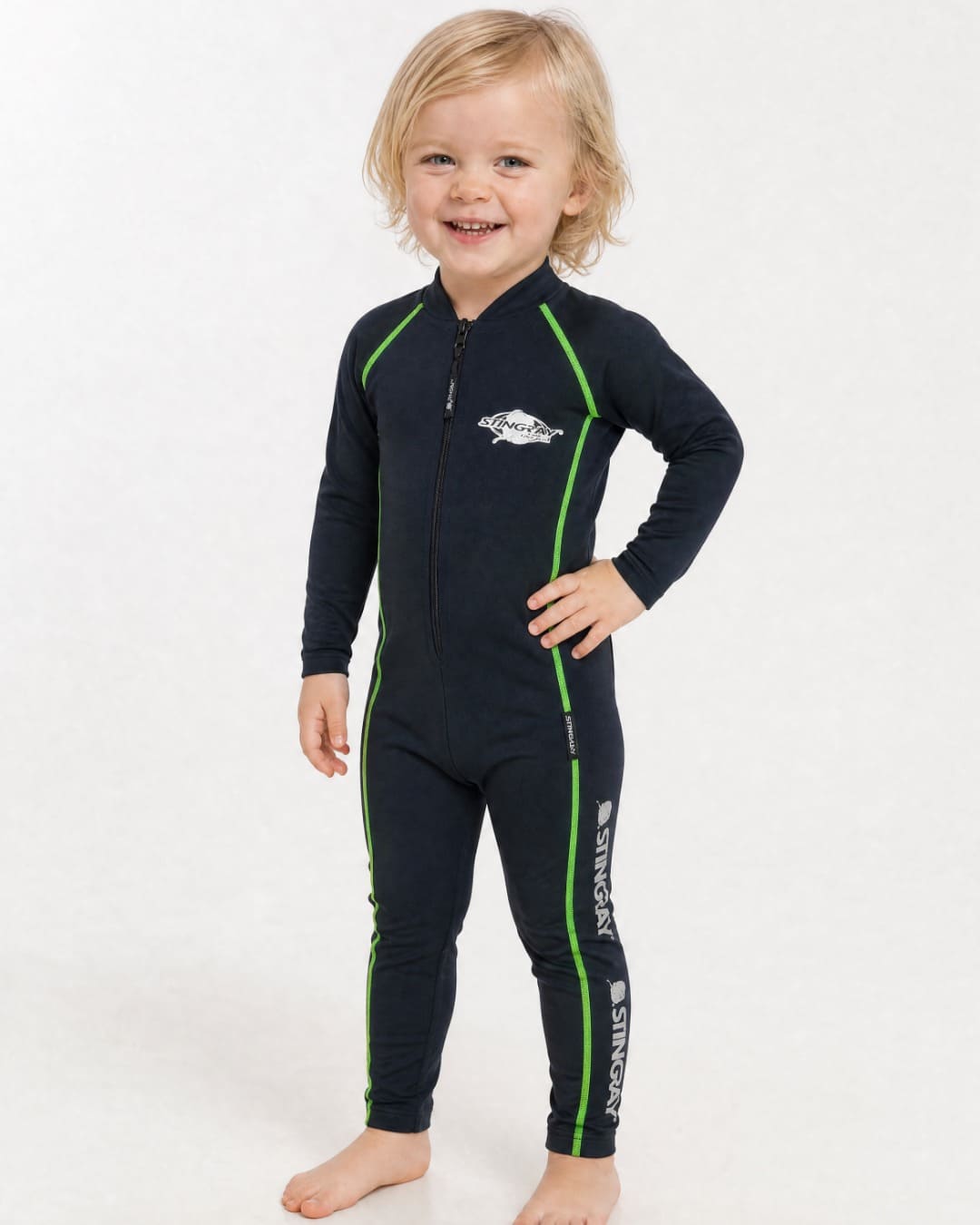 2 year old child/toddler wearing a full-body black UV swimsuit UPF 50+ on a white background