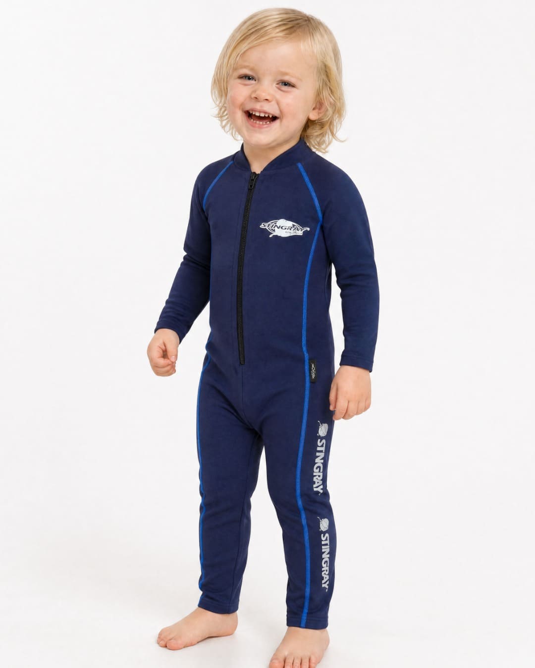 2 year old child/toddler wearing a full-body navy UV swimsuit UPF 50+ on a white background