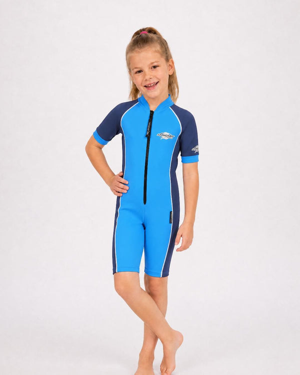Girl wearing a blue and navy short sleeve uv swimsuit on a white background
