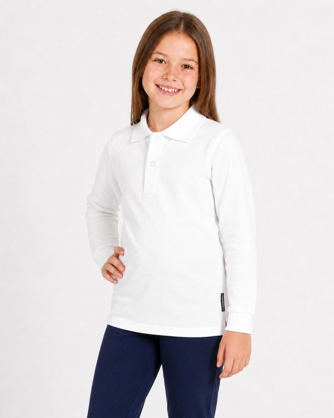 8 year old girl wearing a white long-sleeve UV polo shirt and trousers on a white background