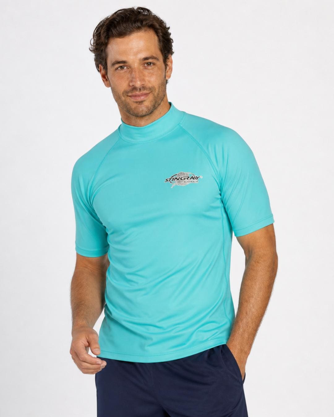 Man wearing aqua/turquoise UV swim shirt UPF 50+ in a white studio