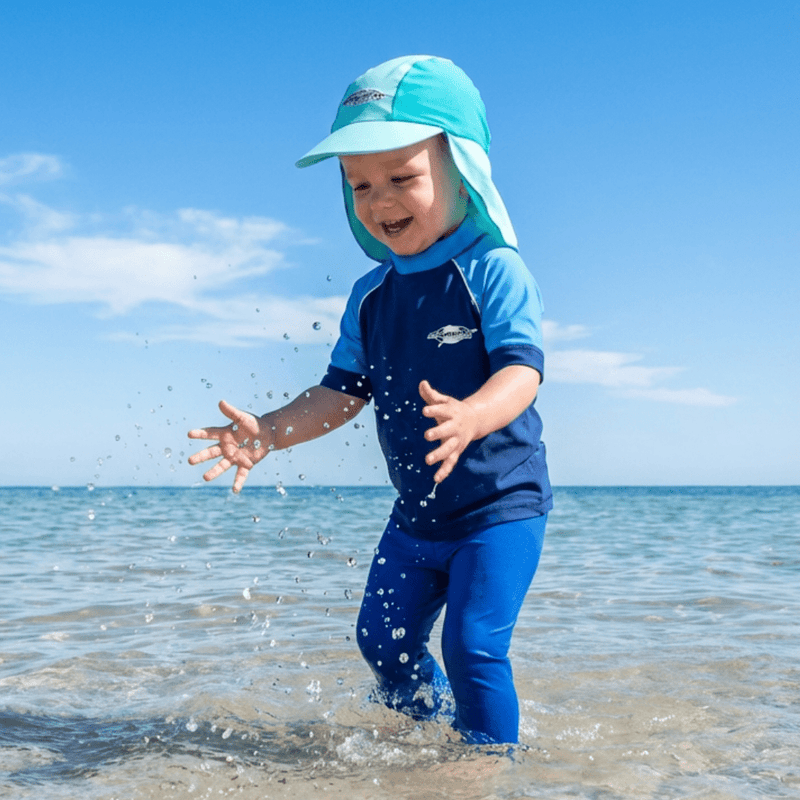 Toddler wearing a upf legionnaire sun hat in the sea