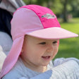 Baby wearing legionnaire hat whilst in the pram