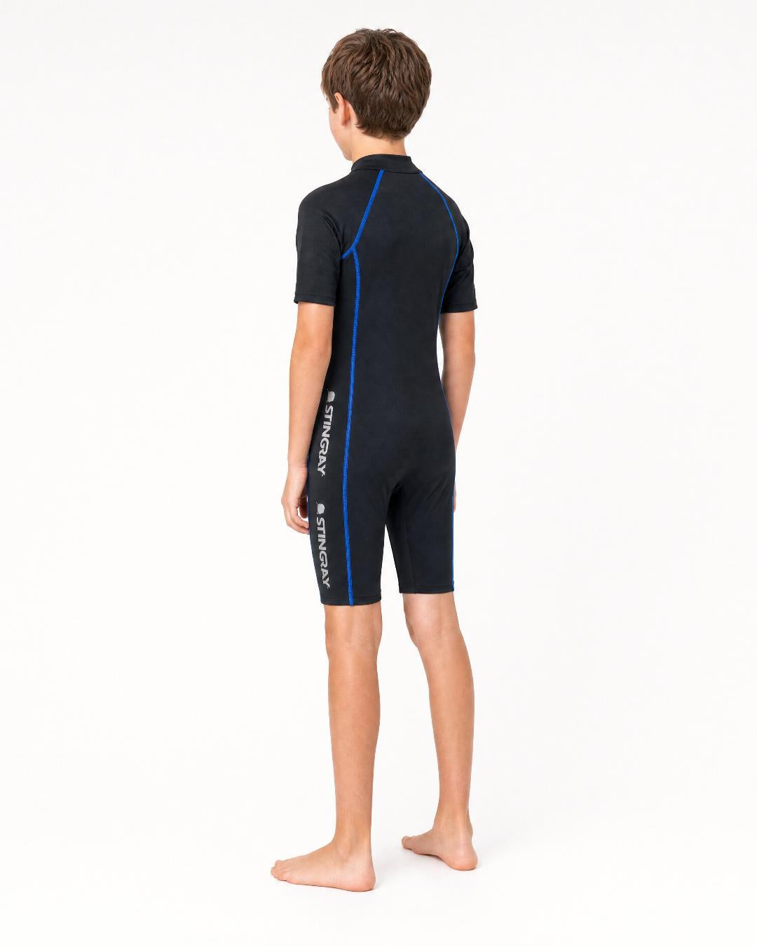 Back of 14 year old boy wearing short sleeve UV swimsuit UPF 50+ - black
