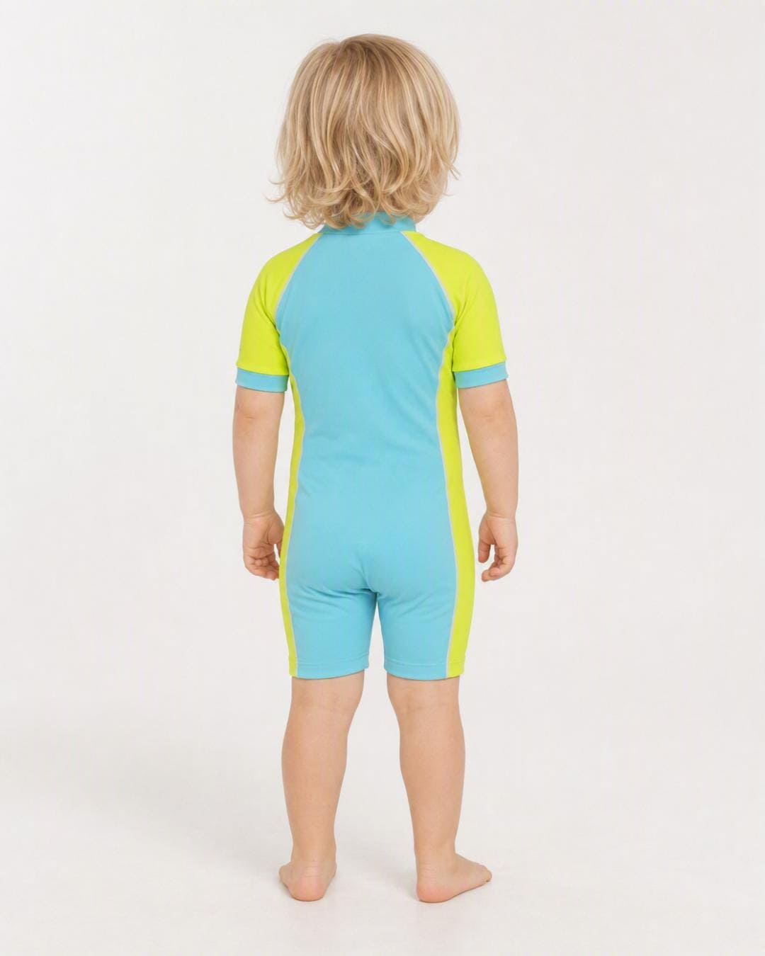 Back of 2 year old toddler wearing short sleeve UV sunsuit - aqua yellow