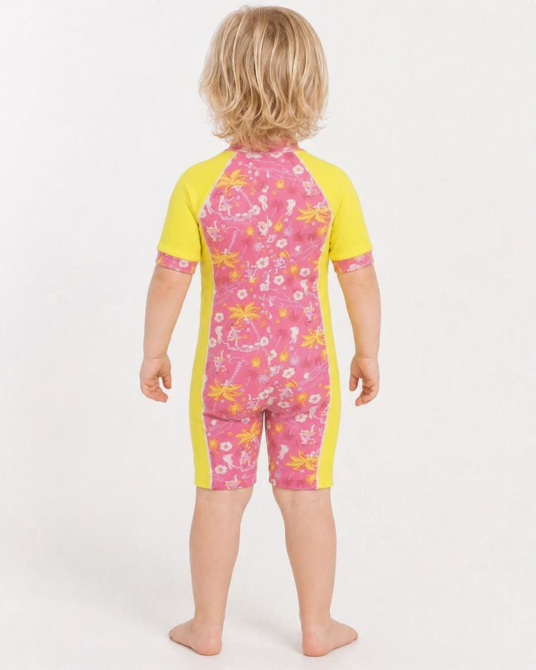 Back of 2 year old toddler wearing short sleeve UV sunsuit - floral yellow