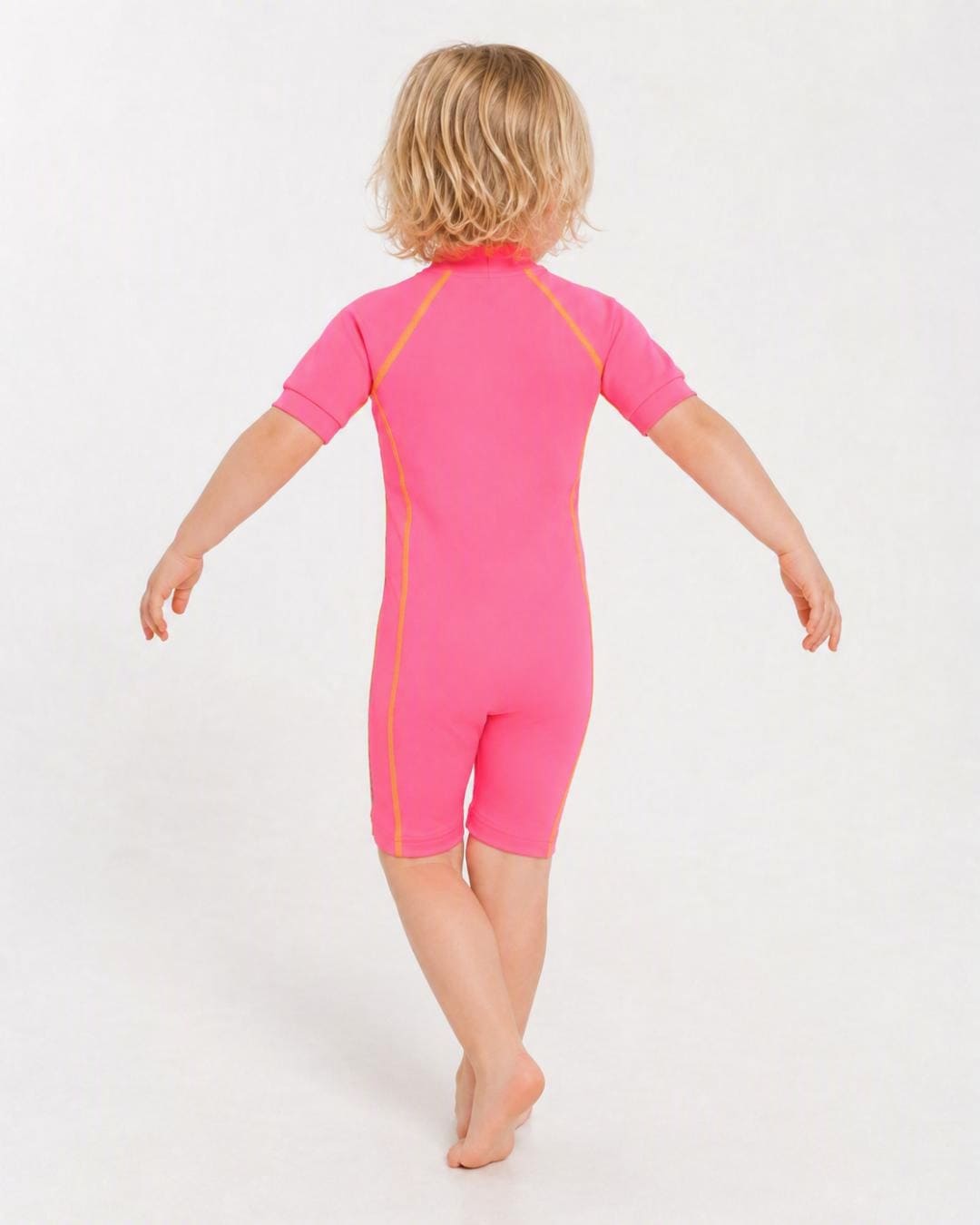 Back of 2 year old toddler wearing short sleeve UV sunsuit - pink