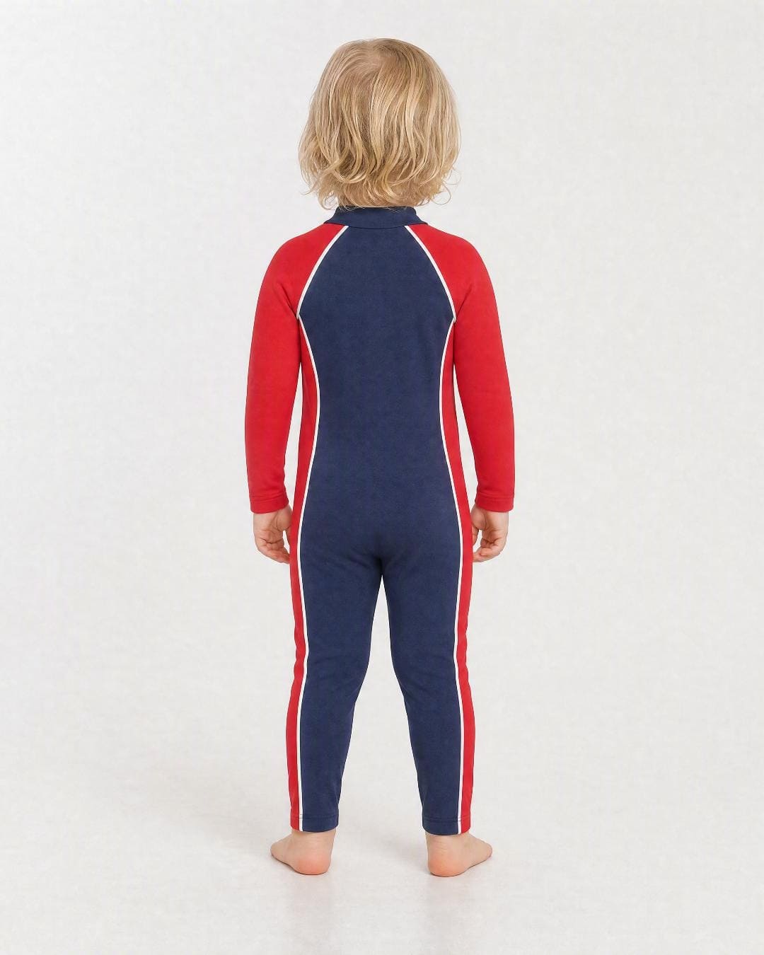 Back of 2 year old wearing full body UV swimsuit UPF 50+ - navy and red