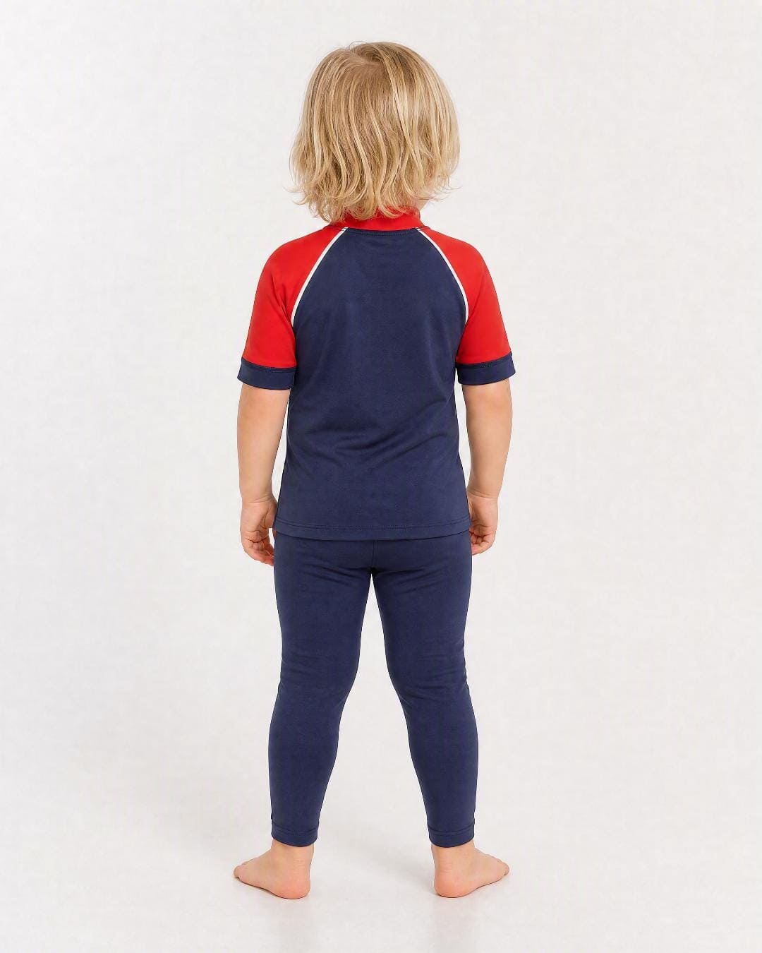 Back of 2 year old wearing short sleeve uv rash vest UPF 50+ - navy and red