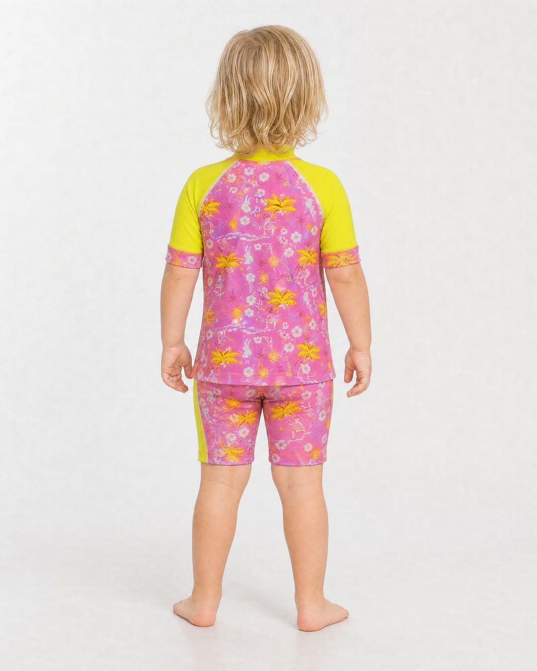 Back of 2 year old wearing short sleeve uv rash vest UPF 50+ - yellow and floral
