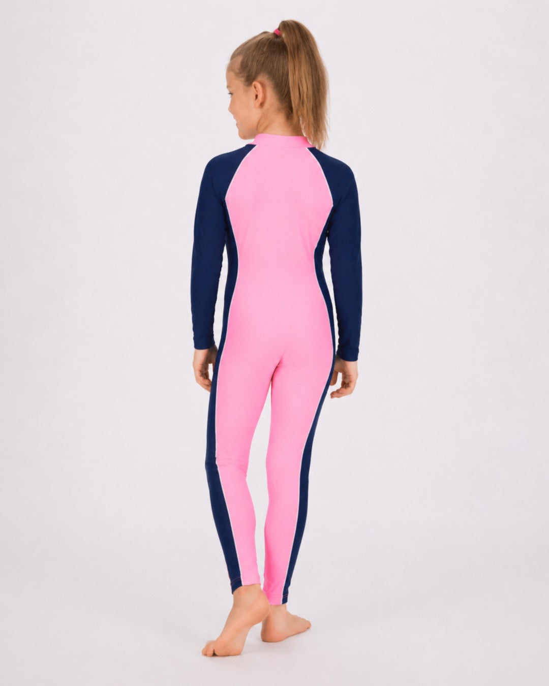 Back of 6 Year Old Girl in Full Body Sunsuit - Pink Navy