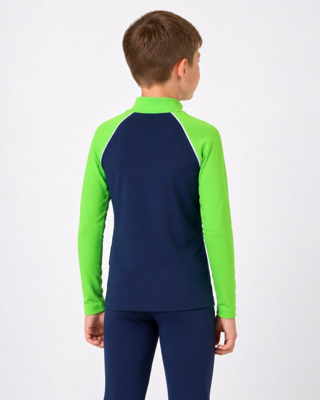 Back of an 8 year old boy wearing a navy and lime long-sleeve UV rash vest on a white background