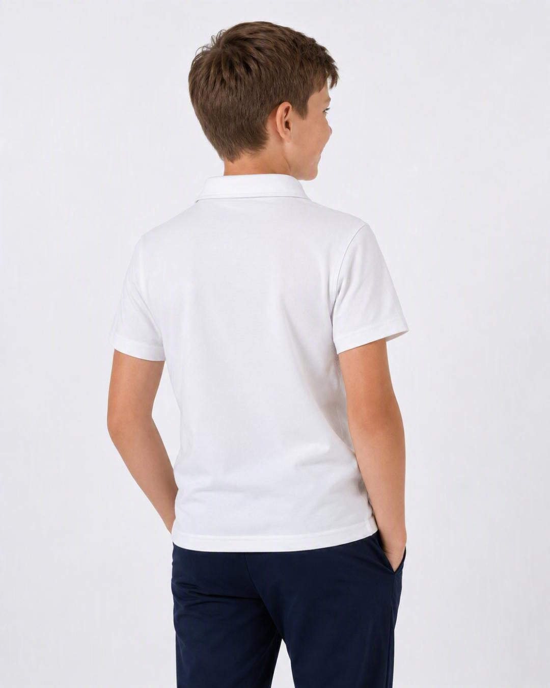 Back of 8 Year Old Wearing Short Sleeve Polo Shirt - White