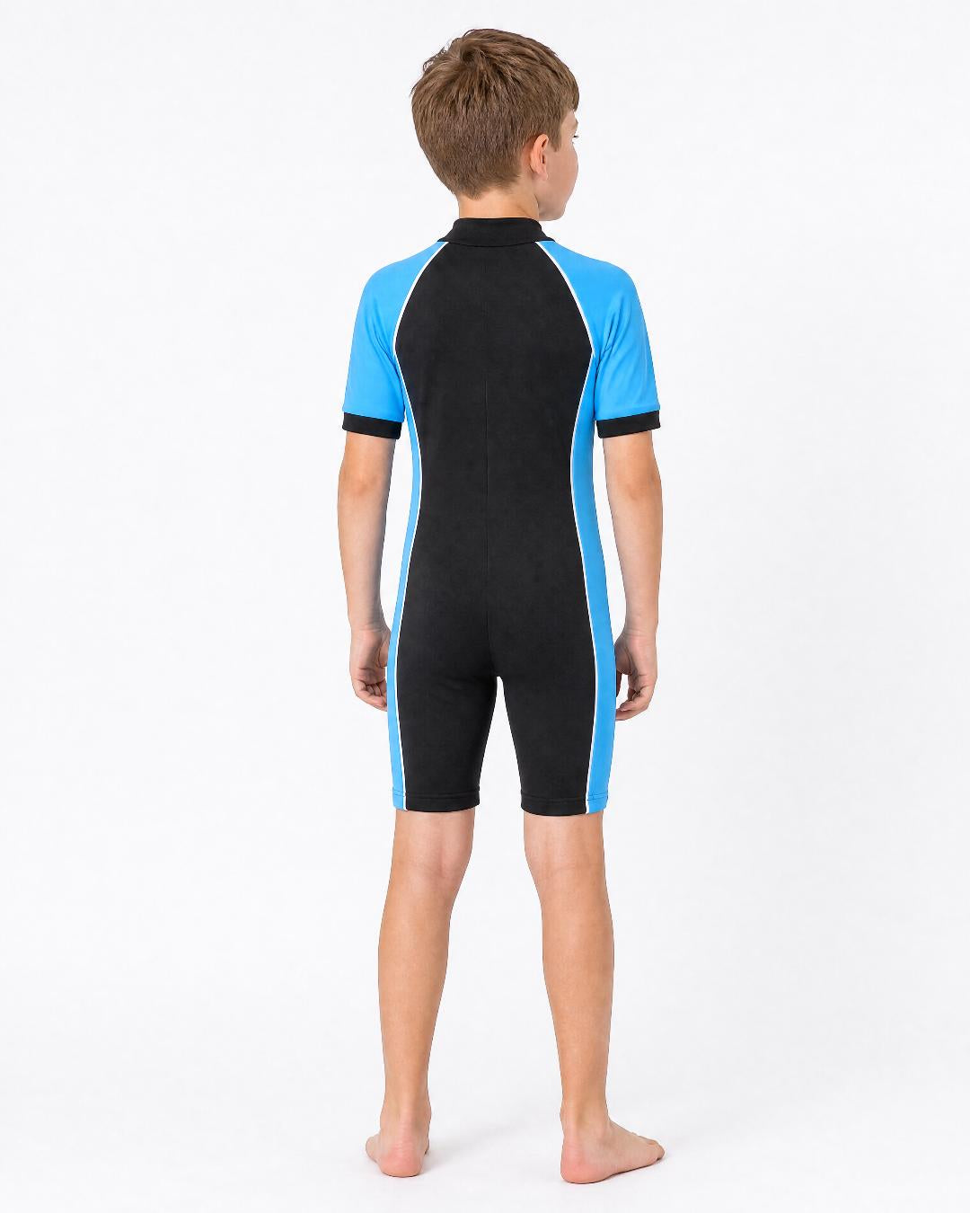 Back of 8 year old boy wearing short sleeve UV swimsuit UPF 50+ - black blue