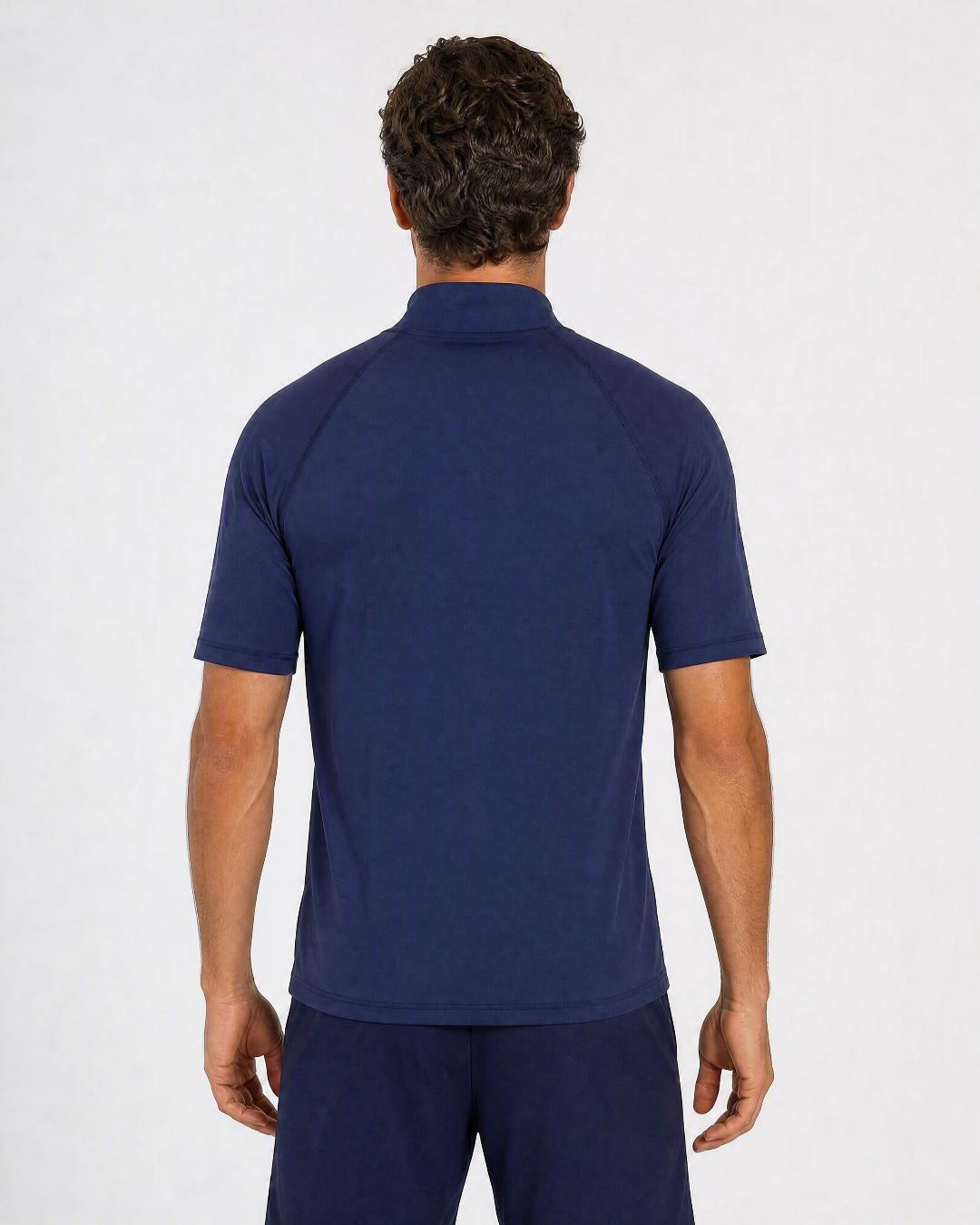 Back of a men's navy UV rash shirt UPF 50+ showing the extended high collar