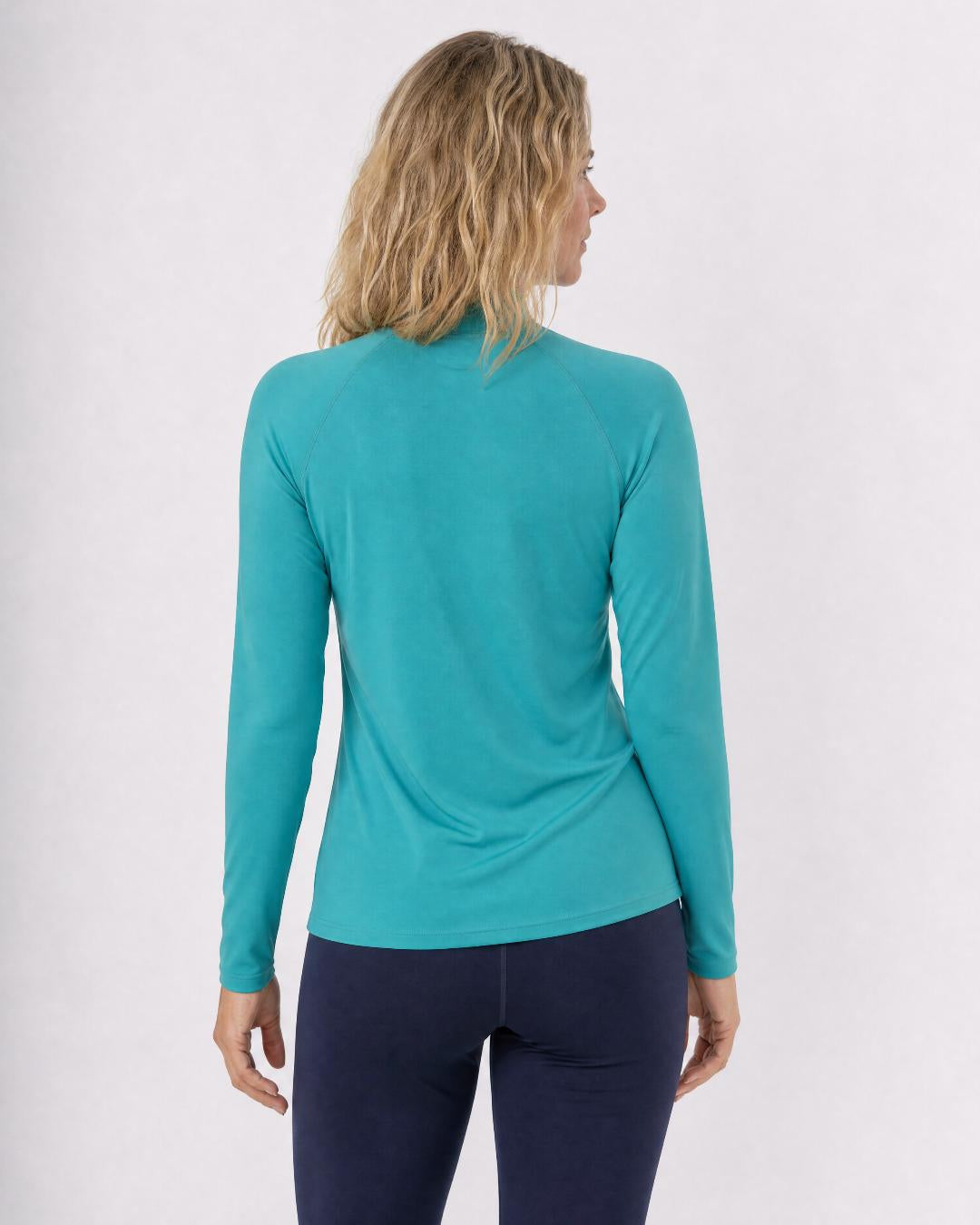 Back of Woman Wearing Long Sleeve UV Rash Shirt UPF 50+ in Teal