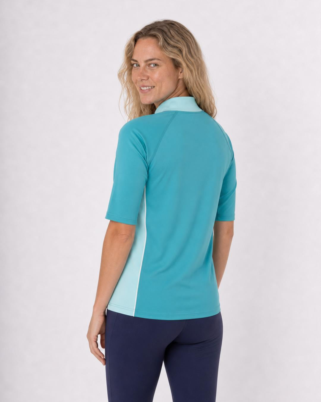 Back of Woman Wearing Short Sleeve UV Rash Shirt UPF 50+ in Aqua Teal