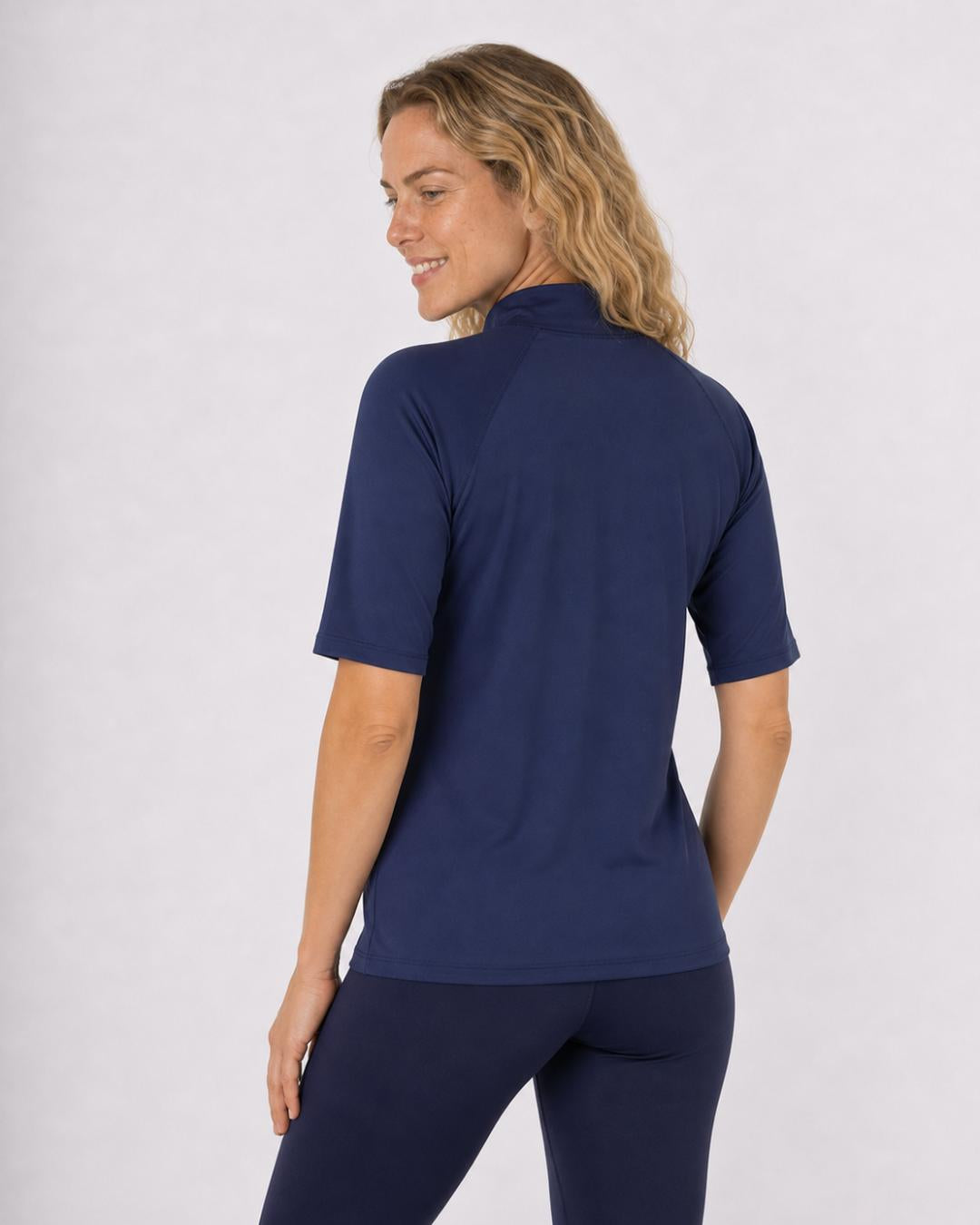 Back of Woman Wearing Short Sleeve UV Rash Shirt UPF 50+ in Navy