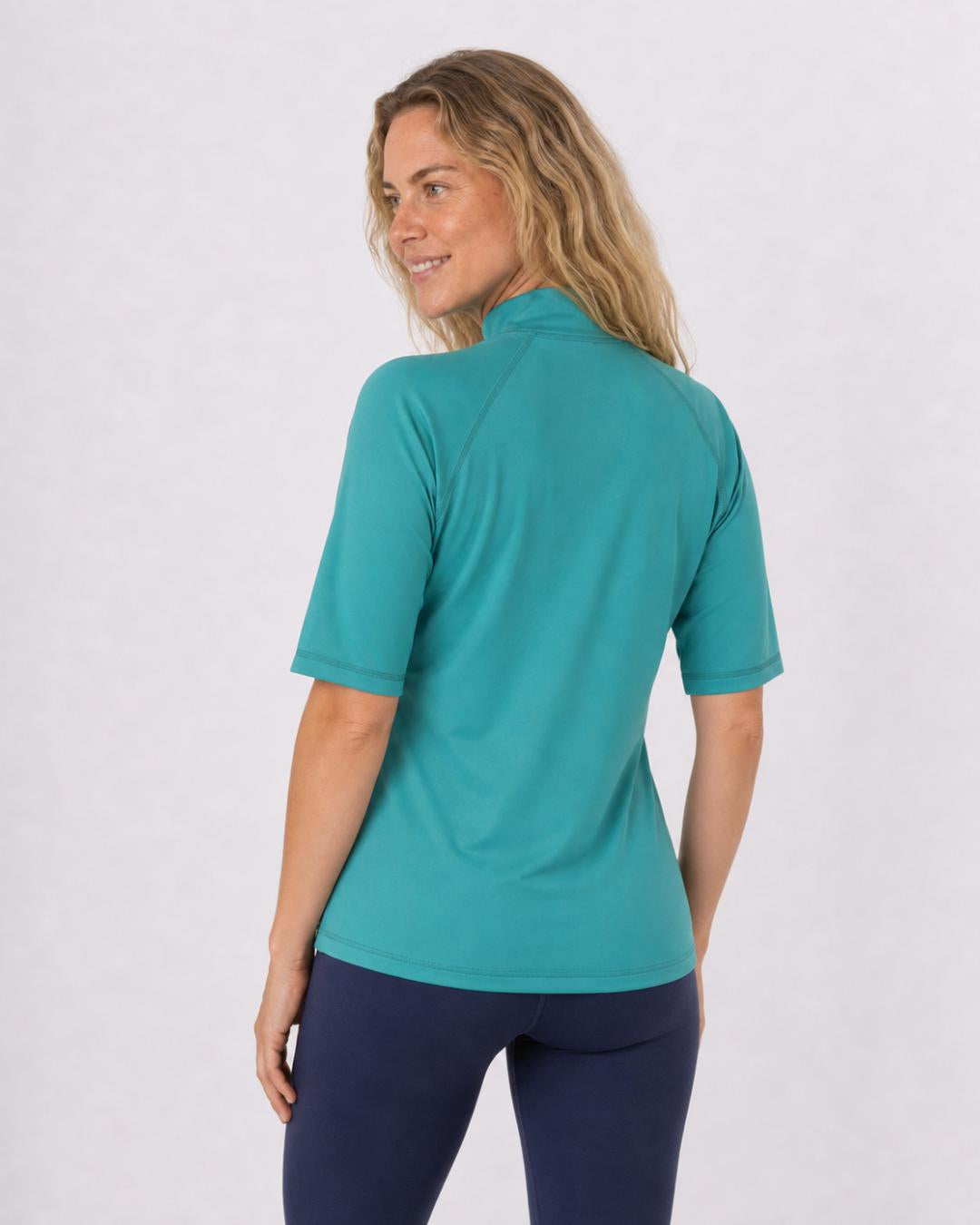 Back of a women's teal UV rash shirt UPF 50+ showing the extended high collar