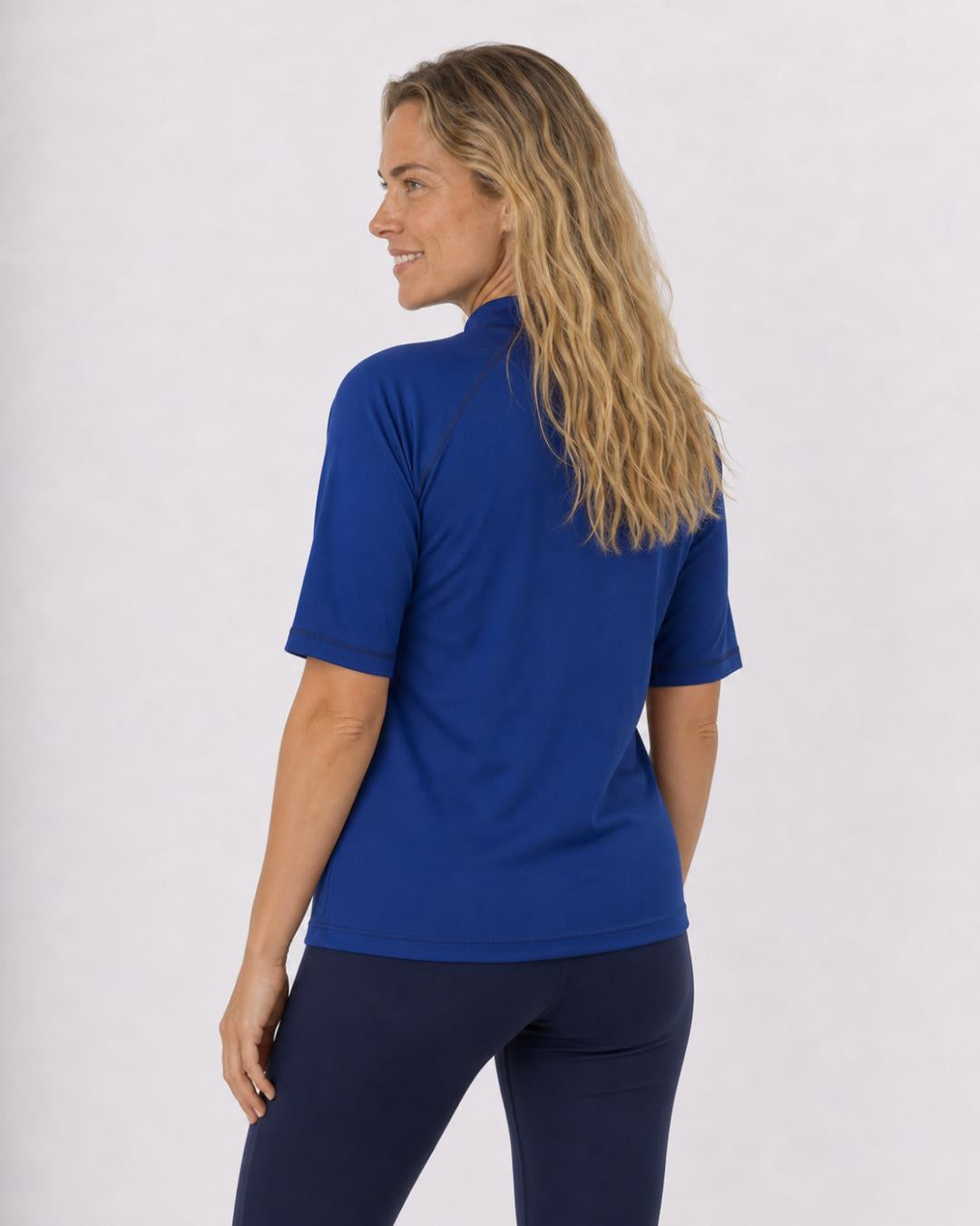 Back of Woman Wearing Short Sleeve UV Swim Shirt UPF 50+ in Ocean Blue