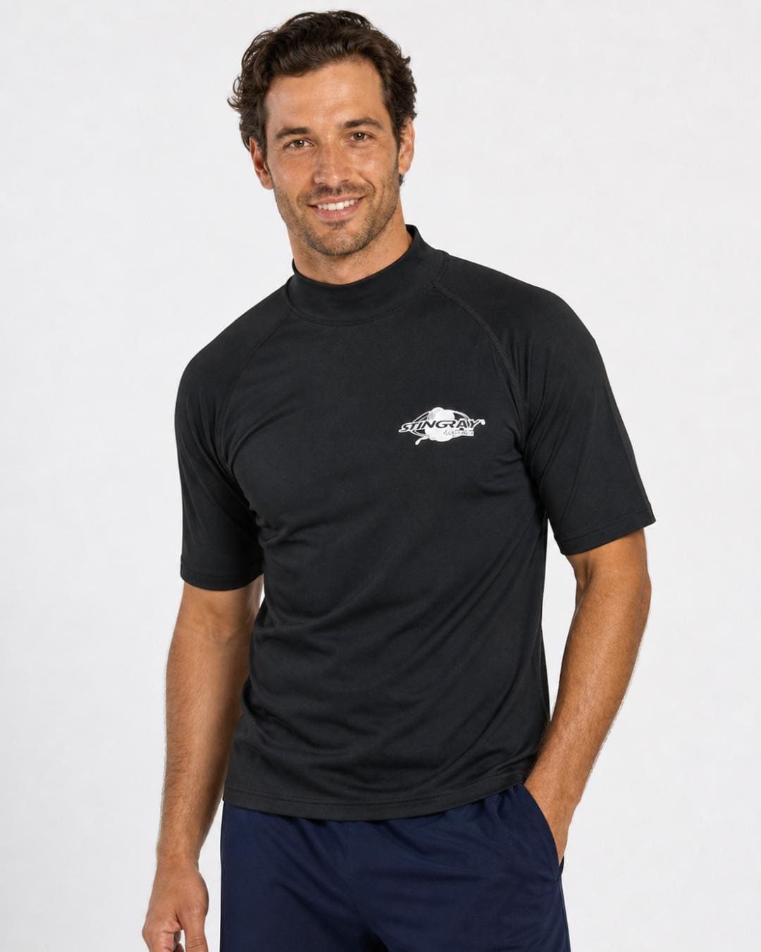 Man wearing black UV swim shirt UPF 50+ in a white studio