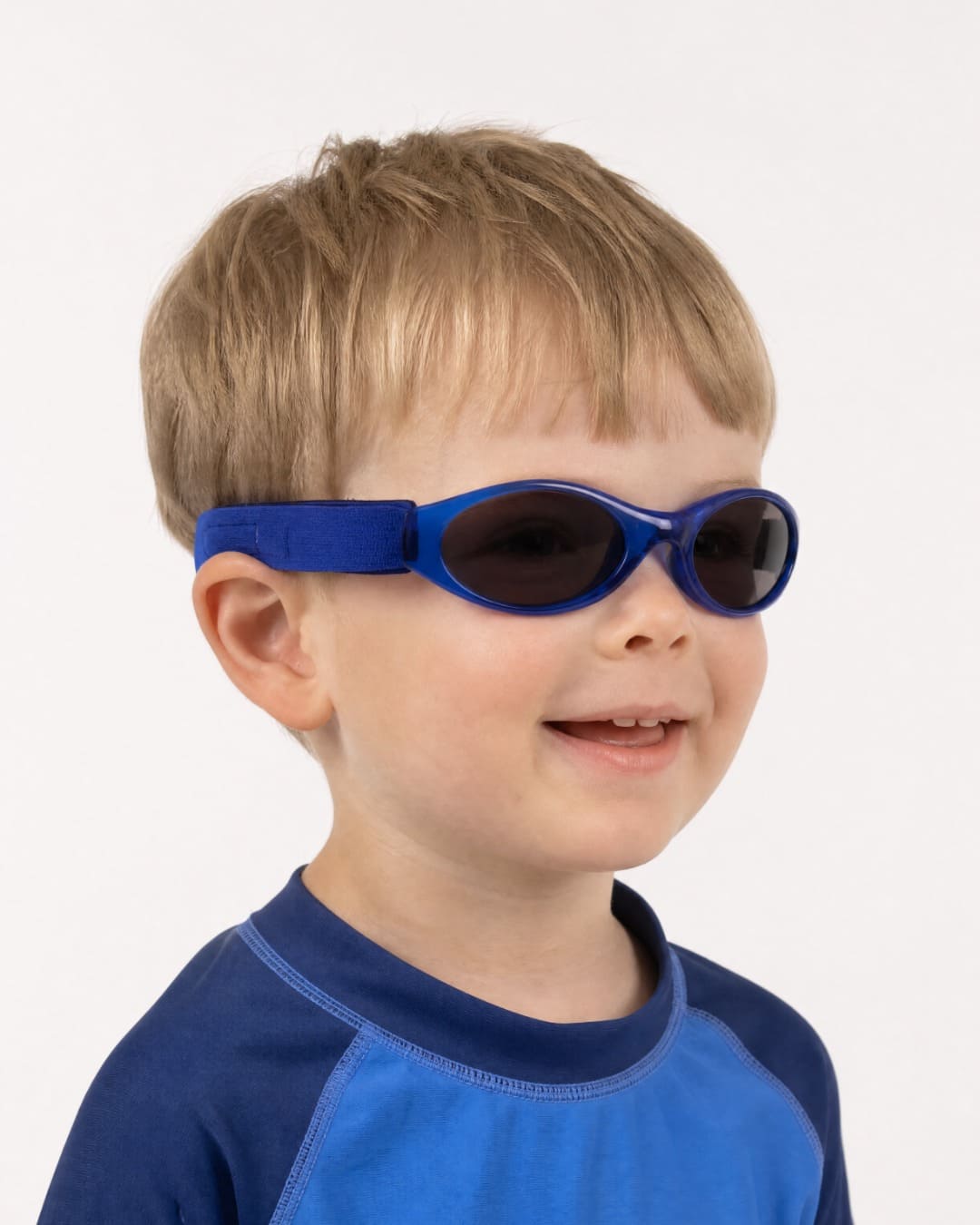Child wearing kids banz sunglasses in blue in studio