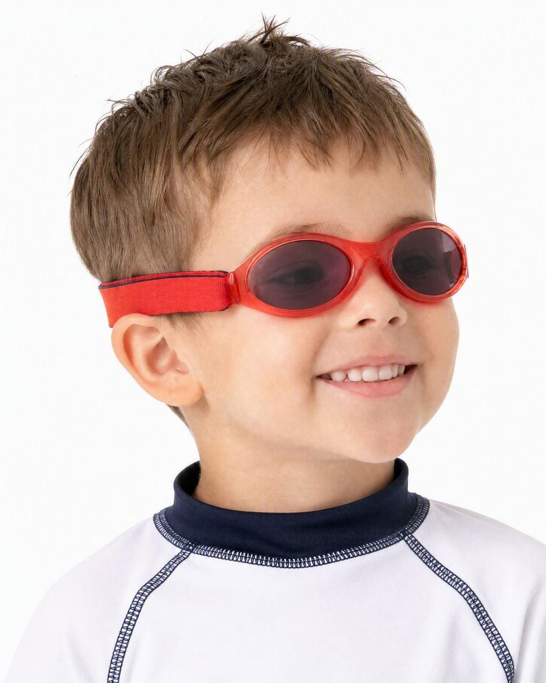 Child wearing kids banz sunglasses in red in studio