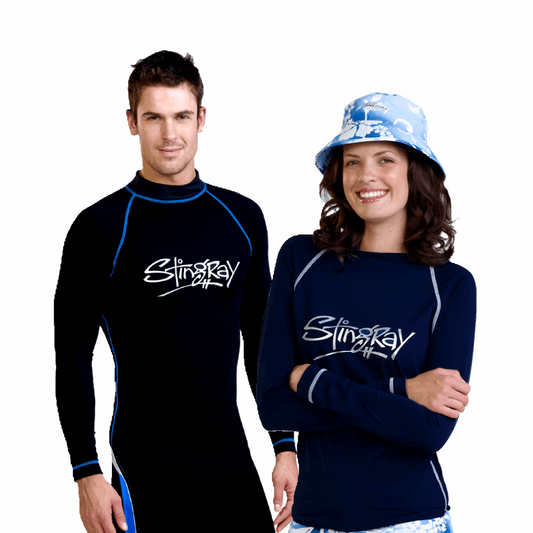 Man and woman wearing the Stingray unisex adult long sleeve rash shirt in black and blue. Rated UPF 50+ UV sun protection to provide the best sun protection.