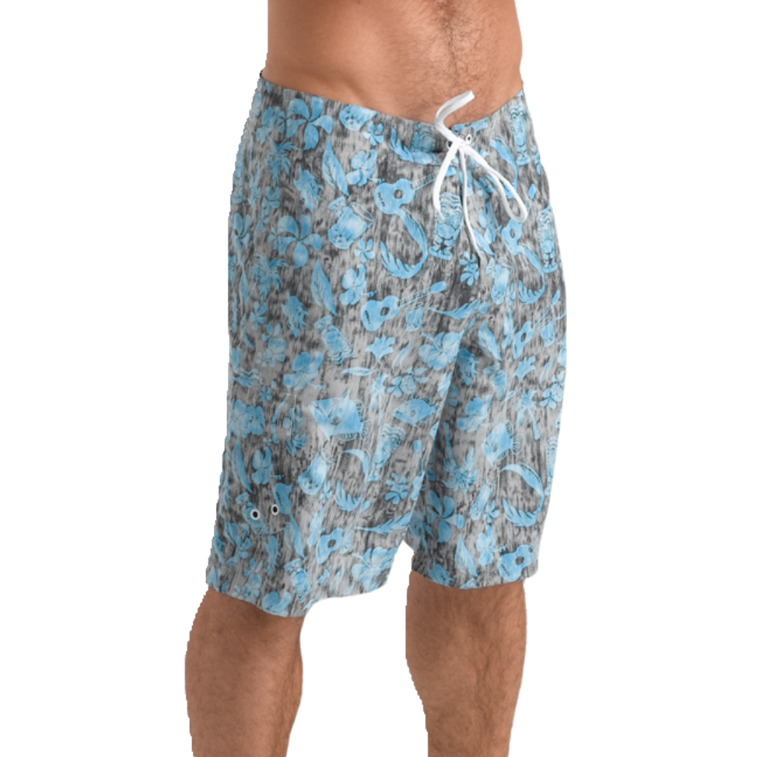 Man wearing the Stingray Unisex  Australian-designed blue Hawaii Board Shorts with UPF 50+ sun protection, featuring a side pocket and drawstring.