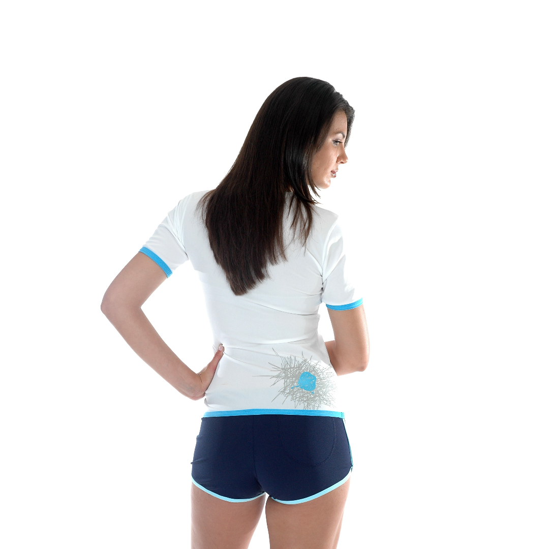 Back image of woman wearing the Stingray Women's Adult Short Sleeve rash shirt in white. This swim shirt is UPF 50+ rated to provide the best UV sun protection.