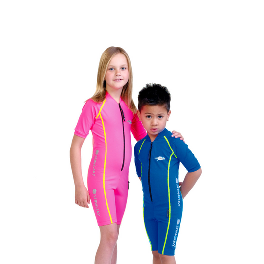 Girl and boy wearing the Pink and ocean blue Stingray Kids' Short Sleeve Sunsuit in Sport Style. This swimsuit is designed with the best UPF 50+ UV sun protection.