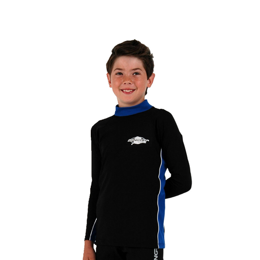 Boy wearing the black and royal blue Stingray Kids' Unisex Long Sleeve Rash Shirt with long sleeves. Designed for the best UPF 50+ protection.