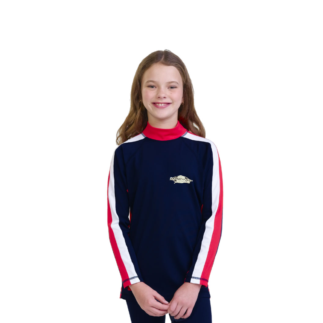 Girl wearing navy red and white Stingray Kids' Unisex Long Sleeve Rash Shirt, tri-colour design with stripe down the sleeve, offering the best UV sun protection with UPF 50+, long sleeves, and a high collar.