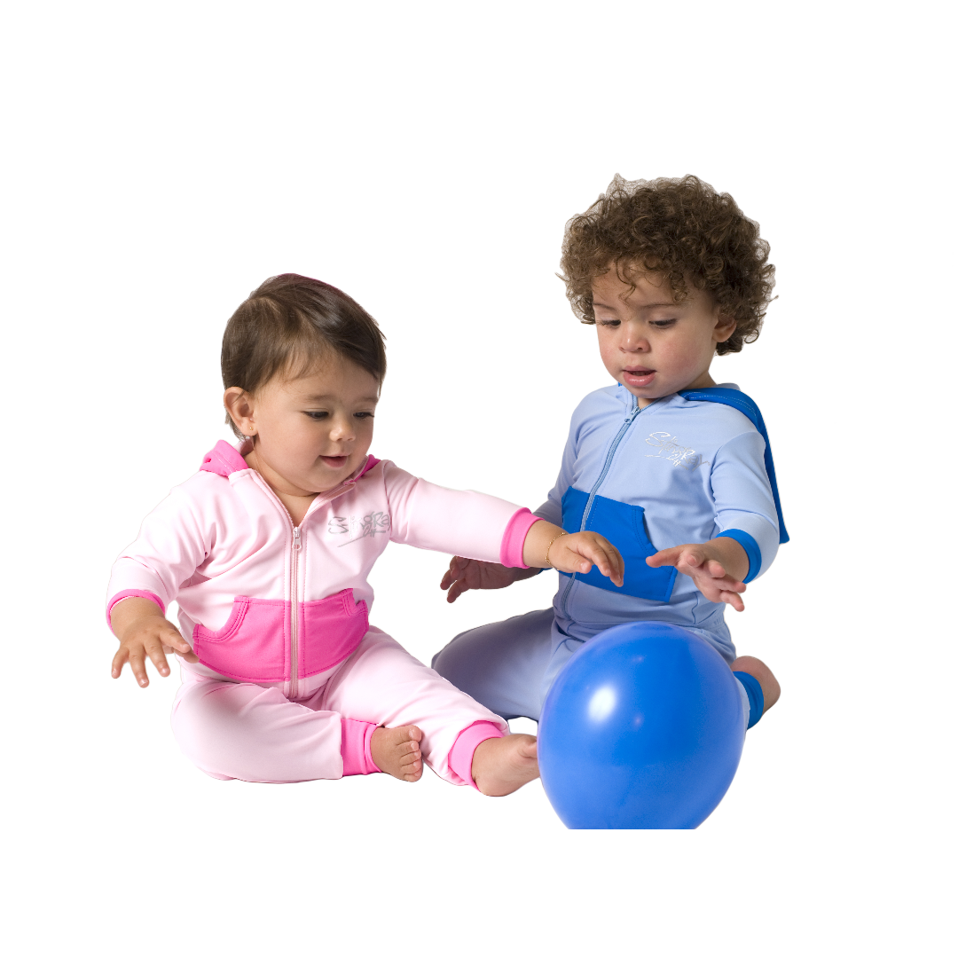 Baby and toddler wearing the best blue and pink Stingray Toddler Jacket & Leggings UPF 50+. Featuring a soft hooded jacket and loose-fitting leggings for the best UV sun protection and comfort.