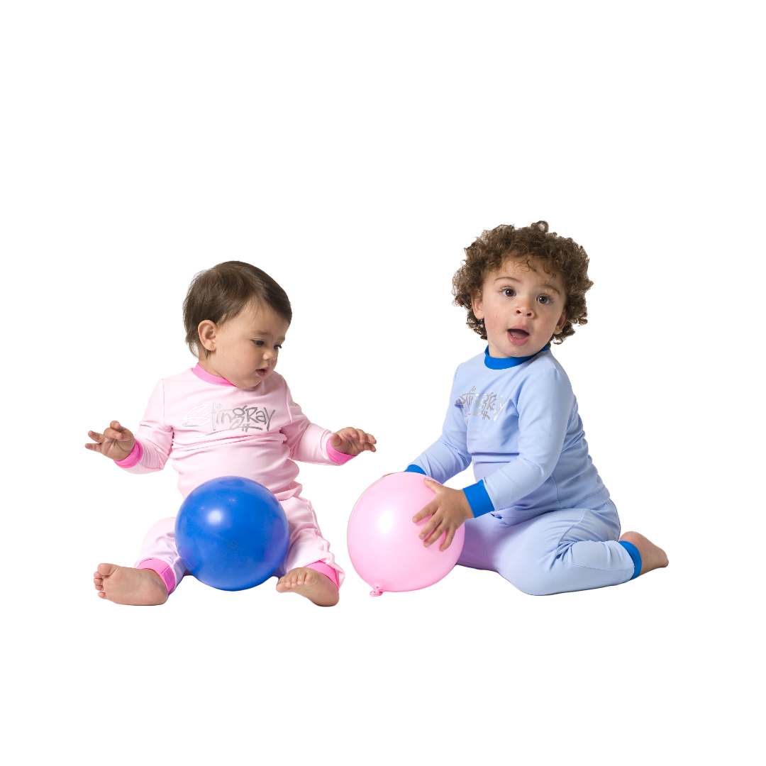 Baby and Toddler wearing the pink and blue Stingray Toddler Two-Piece Sunsuit, featuring a long-sleeve top and leggings for the best full-body UV sun protection and comfort.