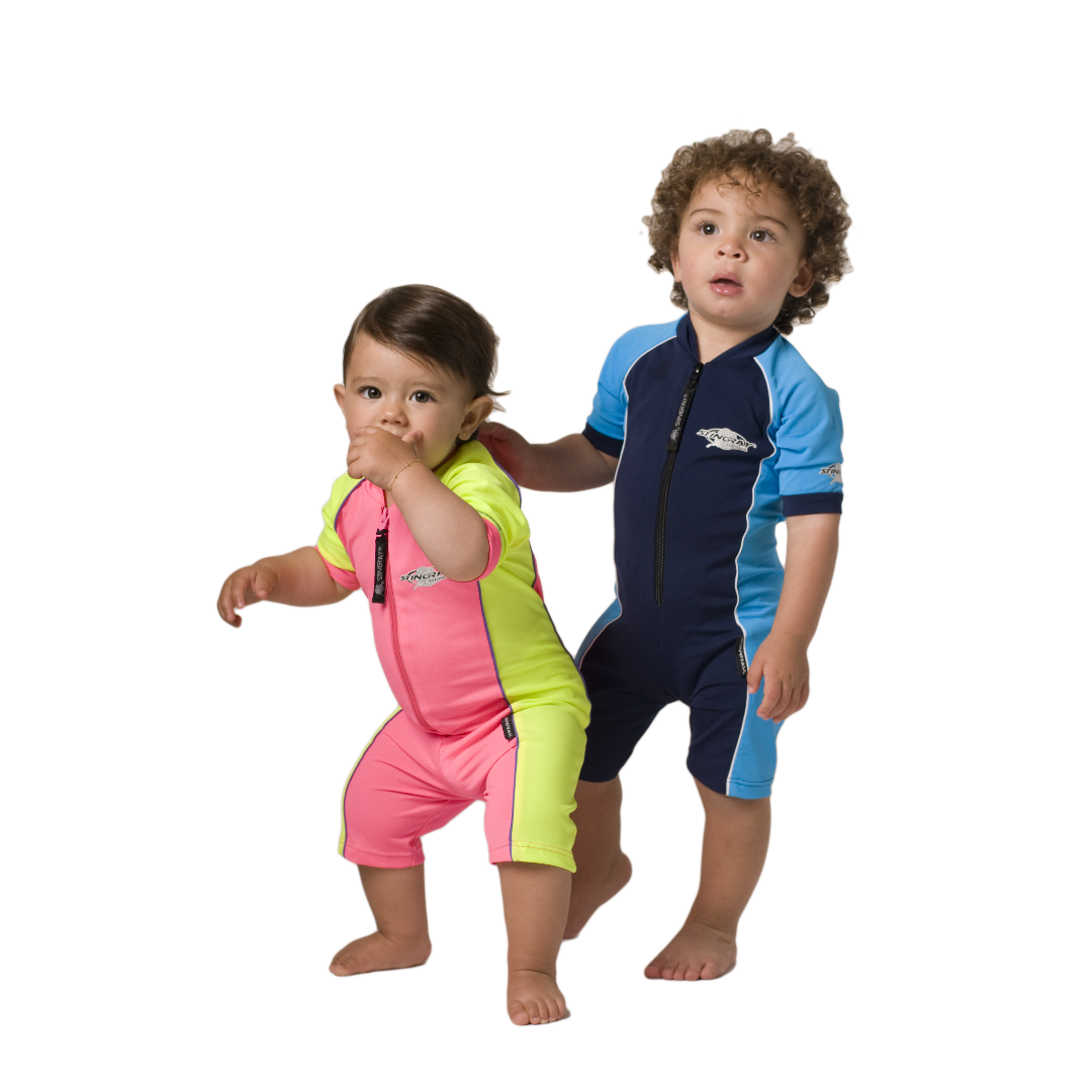 Baby and toddler wearing navy and azure, pink and yellow Stingray Toddler Short Sleeve Sunsuit UPF 50+. This swimsuit provides the best full-body coverage and blocks over 97.5% of harmful UV rays. Perfect for swimming and outdoor activities.